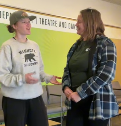 Cuestonian Contributor Kimber Draughton (left) speaks with Cal Poly student Beth Motta (right).